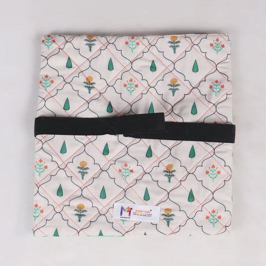 Close up of back side of sensory fidget blanket with different textures, zippers, and buttons, buckles, button maze with net, push button and Velcro and shoe lace pattern, great for tactile stimulation and calm play