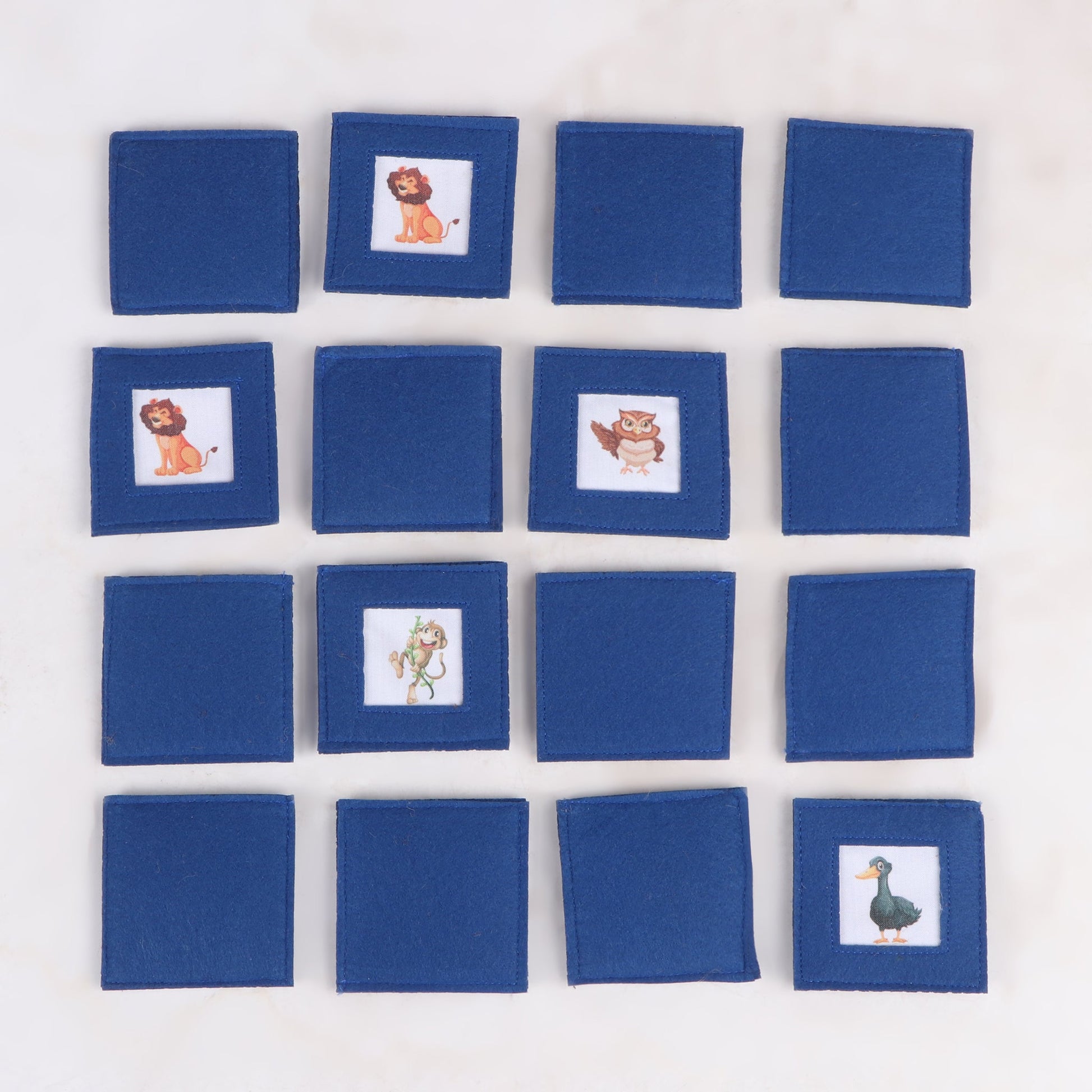 8 sets of handcrafted fabric memory matching game with various animal print, showing its flipped side designed for cognitive development and fun learning