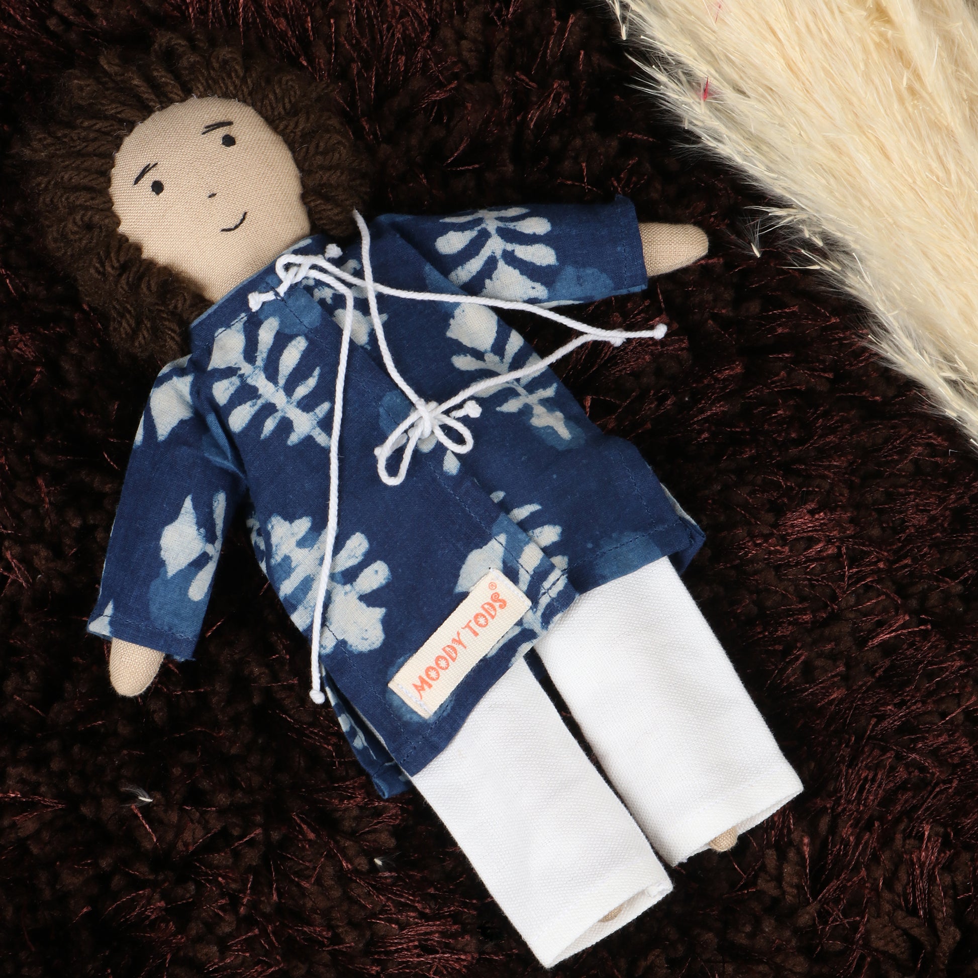 Front view of Cute 9 inch boy rag doll with embroidered features and colorful outfit, made from child-safe, soft fabric