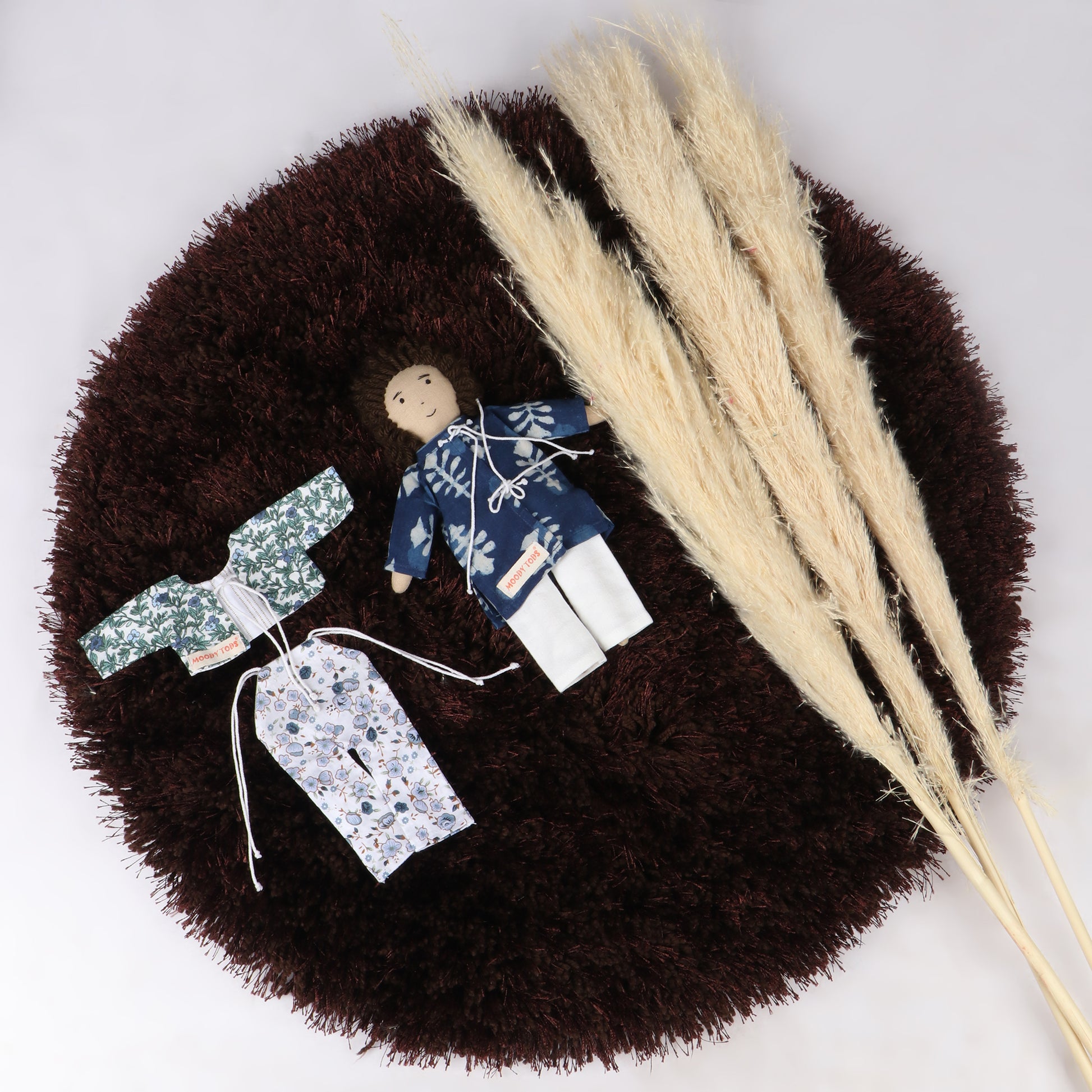 Cute 9 inch boy rag doll with interchangeable outfit made from child-safe, soft fabric