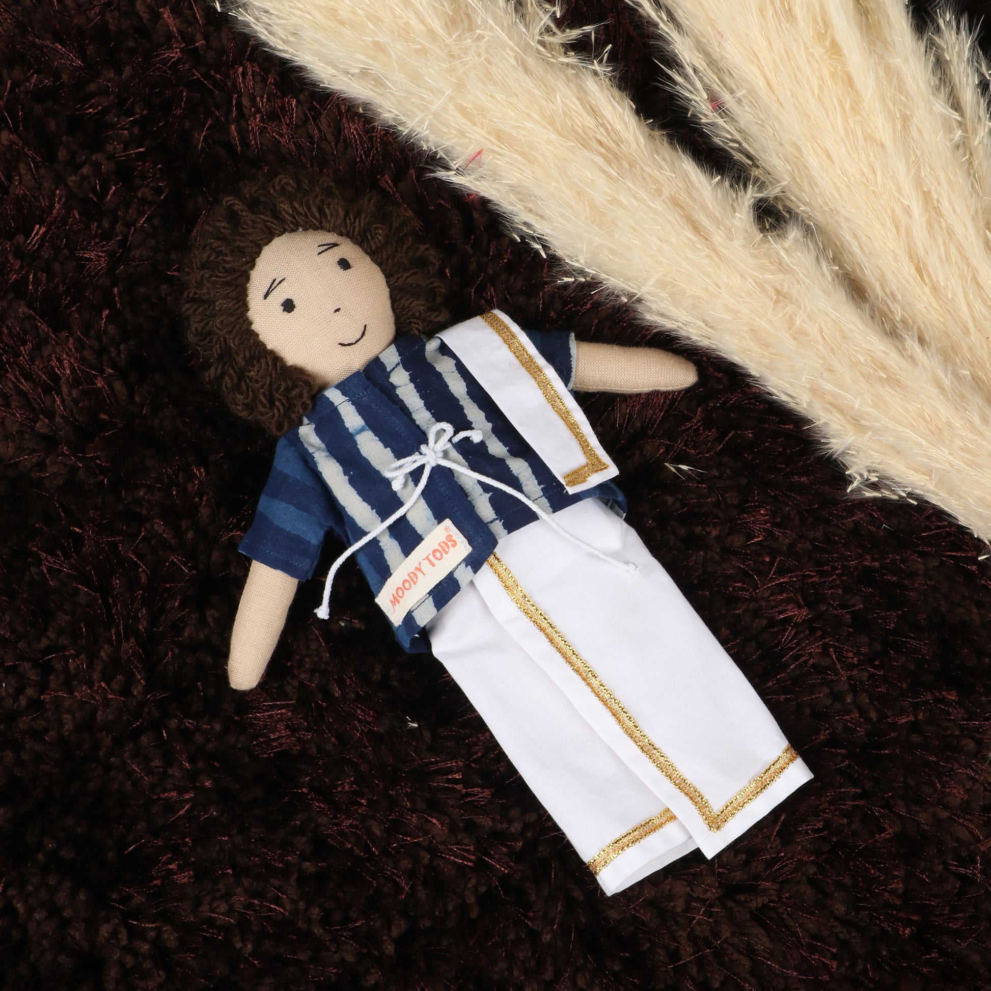 Front angle of 9 inch fabric boy rag doll dressed in Indian outfit made with soft, child-friendly material
