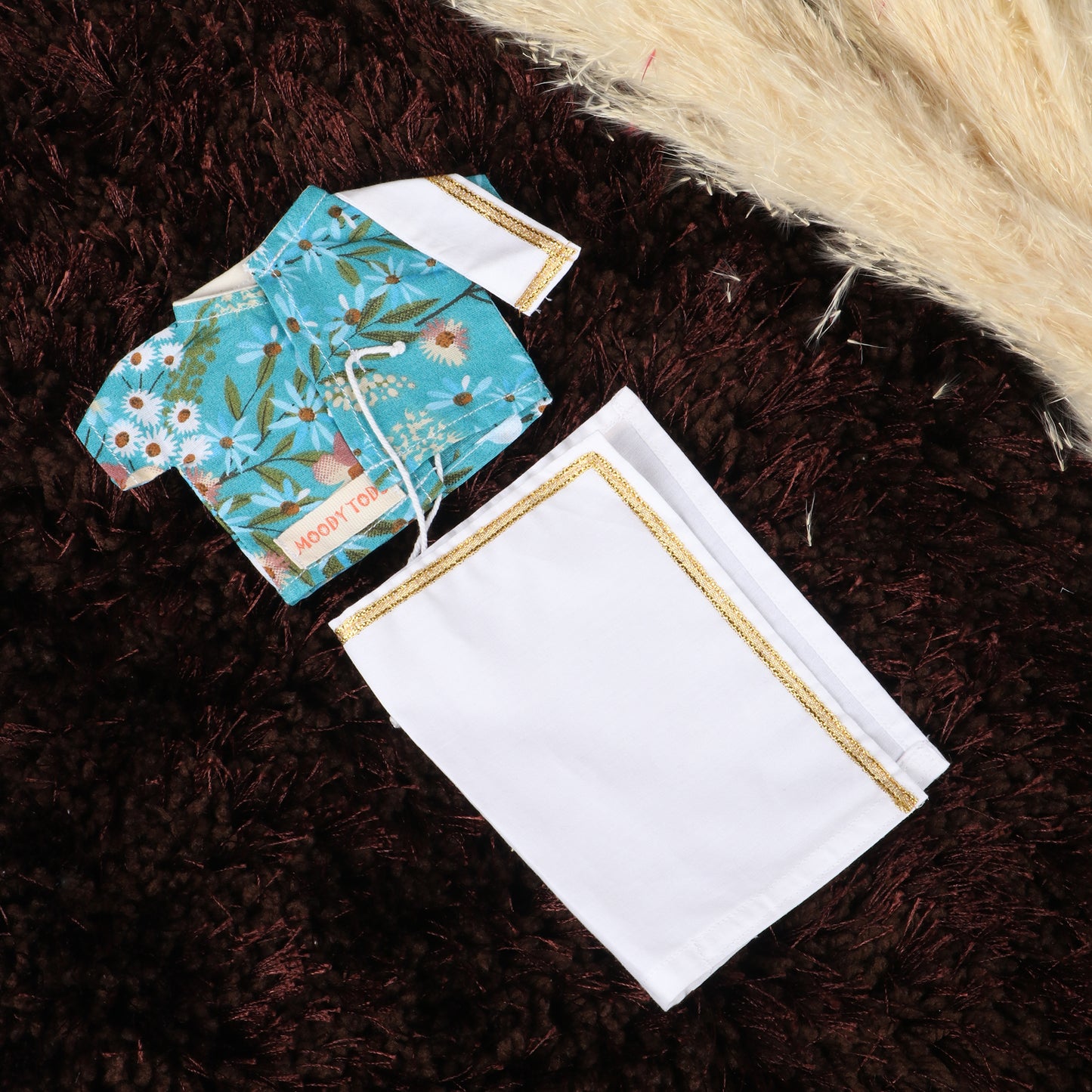 Close up of Cute floral shirt for 9 inch boy rag doll, made from child-safe, soft fabric