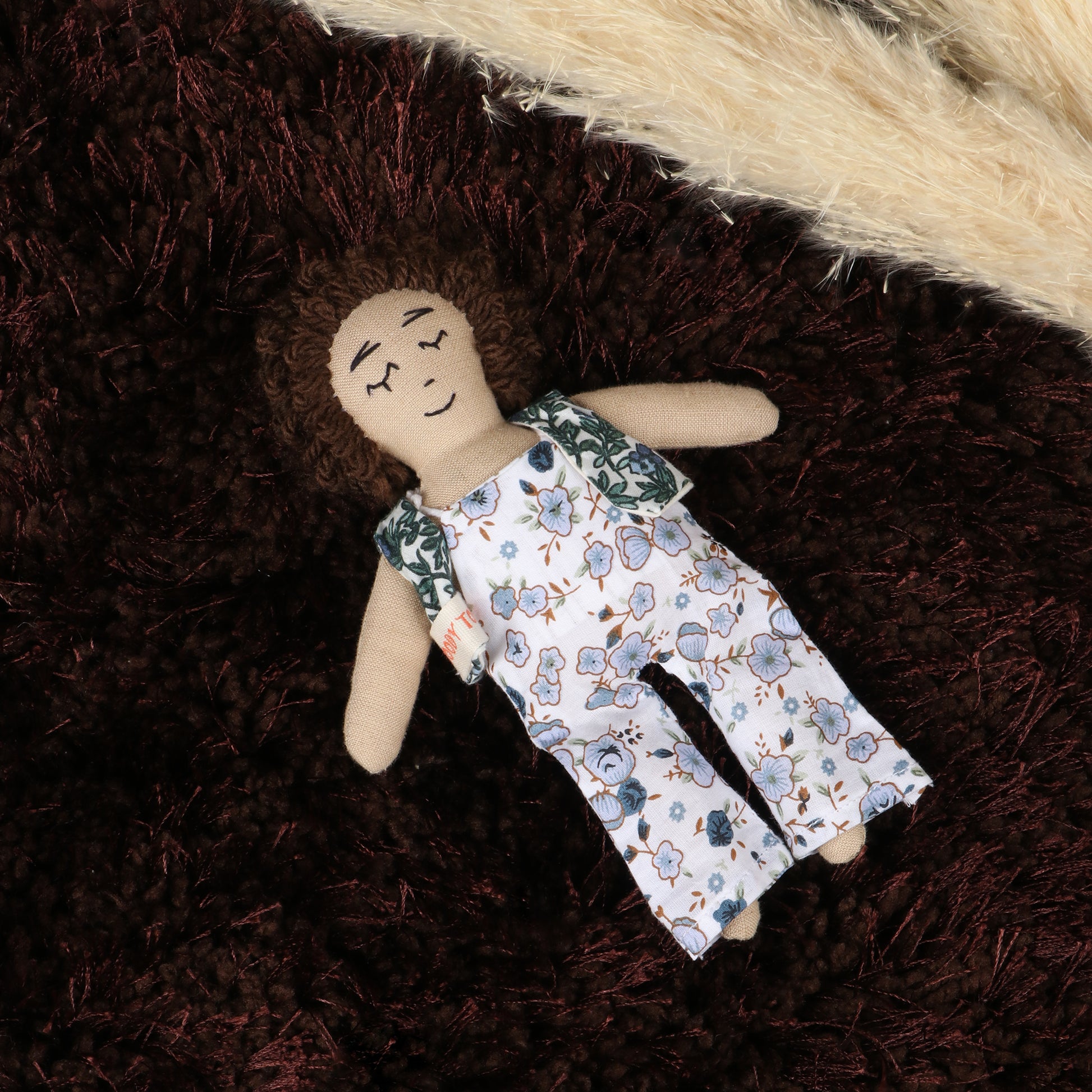 7 inch handmade fabric boy rag dolls in floral outfit made with soft, child-friendly material
