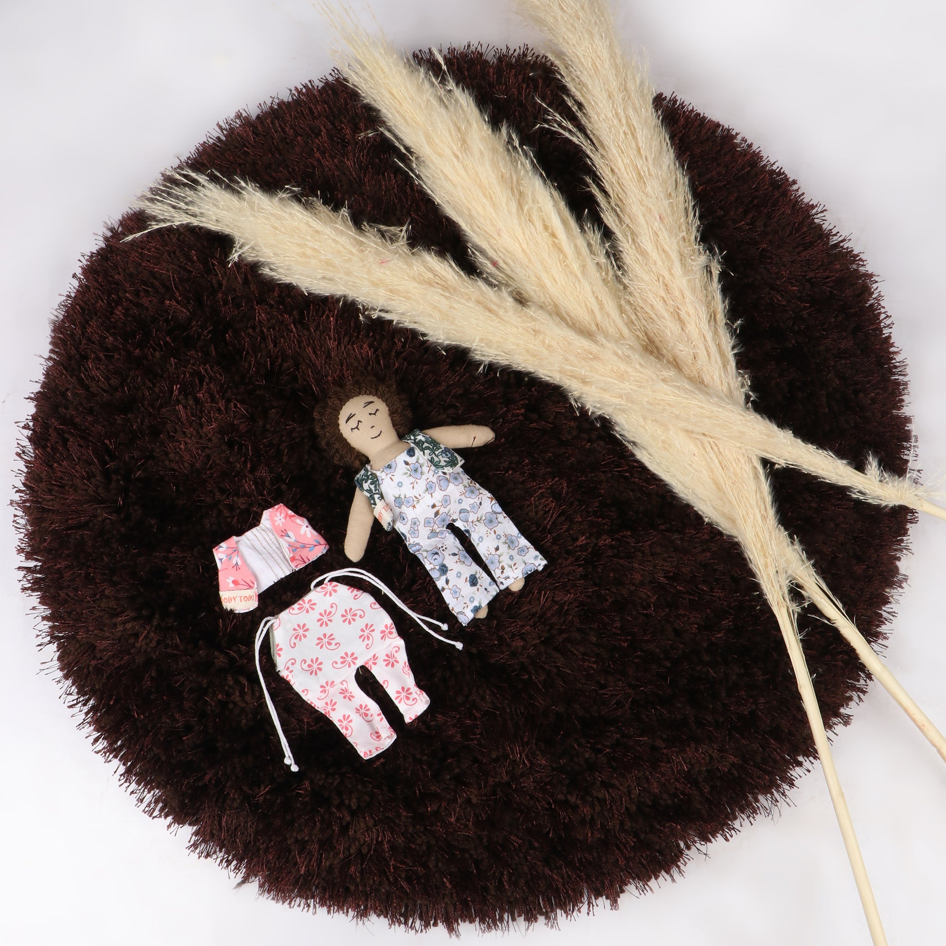 7 inch handmade fabric boy rag doll with interchangeable dress made with soft, sensory-friendly material, designed for comfort and imaginative play