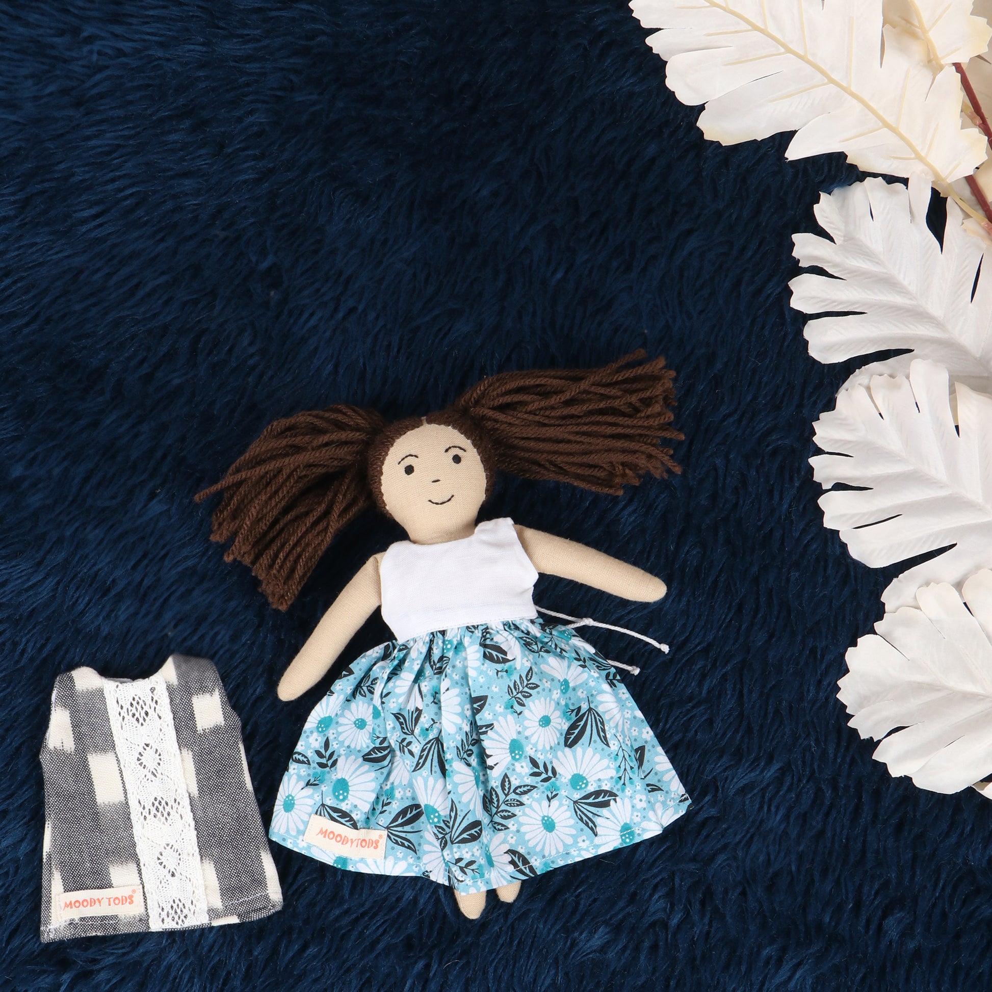 9 inch handmade fabric rag doll with interchangeable grey outfit made from child-safe, soft fabric.