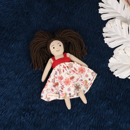 Cute 9 inch girl rag doll with red and pink frock and brown hair, made from child-safe, soft fabric