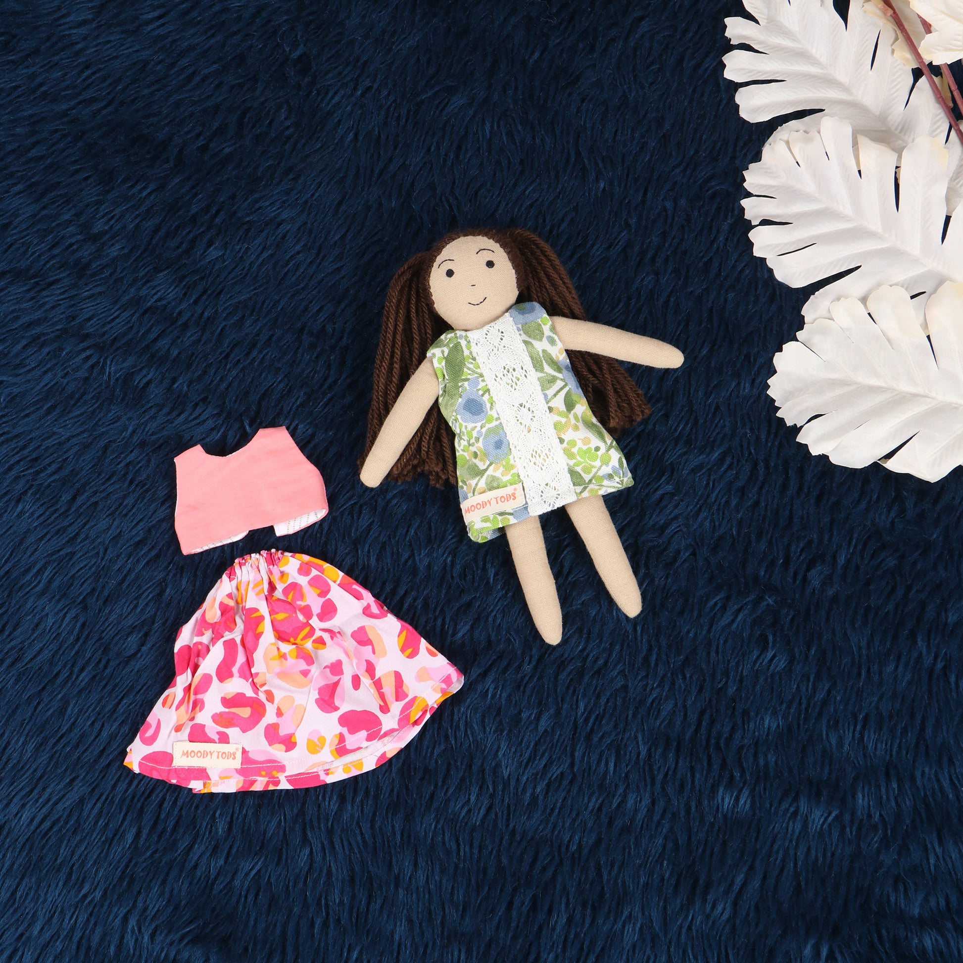 Cute handmade fabric rag doll with interchangeable outfit, made with sensory-friendly material, designed for comfort and imaginative play