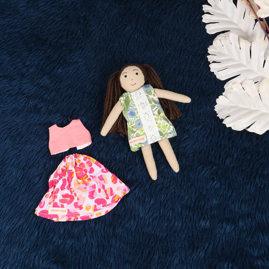 Cute handmade fabric rag doll with interchangeable outfit, made with sensory-friendly material, designed for comfort and imaginative play