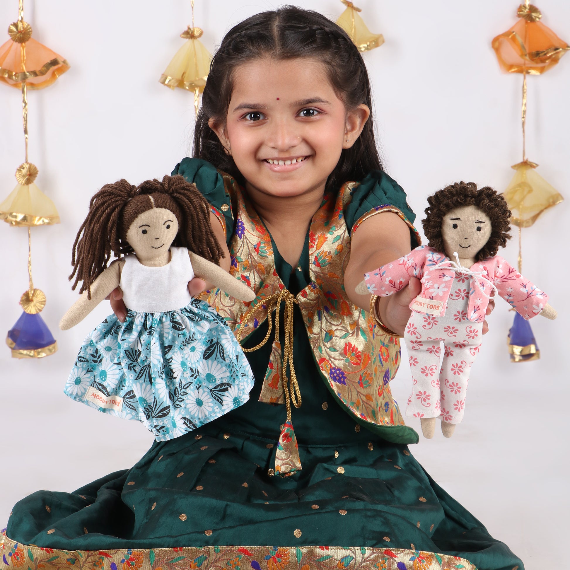 Little girl holding two 9 inch doll demonstrating its child-friendly size and comfort made from child-safe, soft fabric